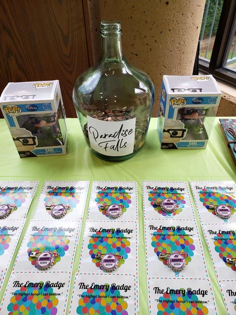 Disney Pixar Up party Paradise Falls money jar Pixar Up Wedding Theme, Disney Up Party Ideas, Disney Retirement Party, Up Movie Birthday Theme, Up Themed Graduation Party, Up Movie Baby Shower Theme, Up Decorations Pixar, Paradise Falls Jar, Up Party Theme Disney