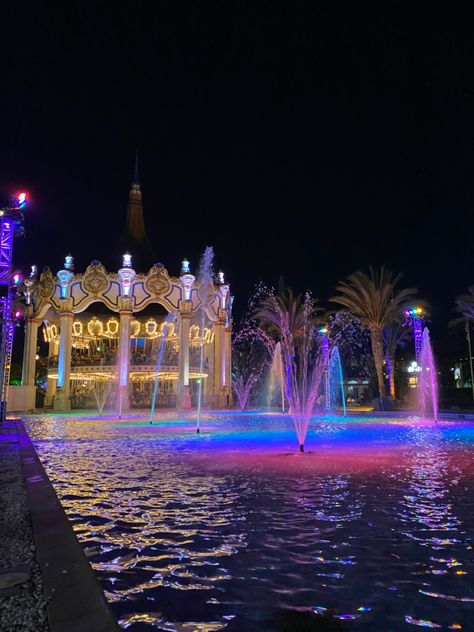 pretty waterfountain in front of Great America Amusement Park in California with a merry go round behind it too Amusement Park Landscape, Great America Theme Park California, Amusement Park Aesthetic Night, Amusement Park Aesthetic Rollercoaster, Amusement Park At Night, Great America Amusement Park, Great America, Merry Go Round, Pretty Stuff