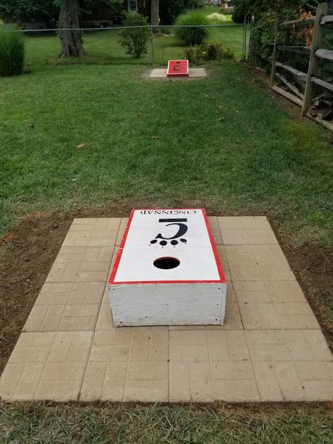 Back yard cornhole Corn Hole Yard Ideas, Cornhole Area Ideas, Backyard Cornhole Ideas, Cornhole Court Backyard Ideas, Corn Hole Playing Area, Backyard Cornhole Court, Cornhole Backyard Setup, Cornhole Backyard, Cornhole Playing Area