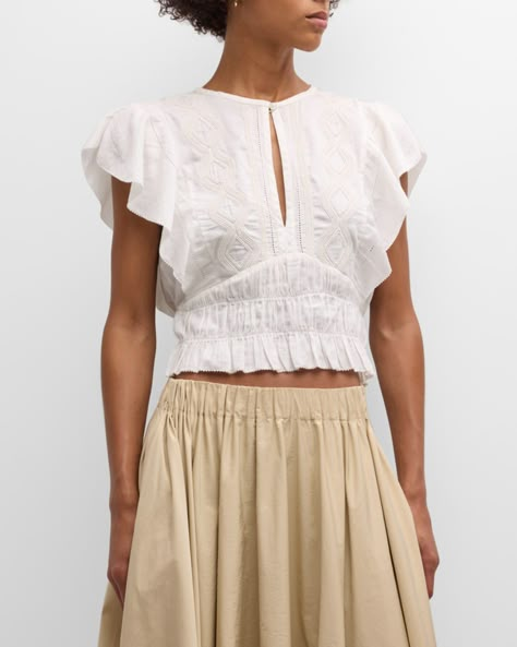 Iro "Odula" embroidered cotton blouse featuring a smocked hem     High neckline with keyhole closure     Flutter sleeves    Cropped fit    Hem sits at the hip    Cotton    Dry clean    Imported Embroidered Fashion, High Summer Fashion, Blouse With Sleeves, Embroidered Blouses, Cropped Blouse, Smocked Blouse, Blouse Top, Cropped Top, Fitted Blouse