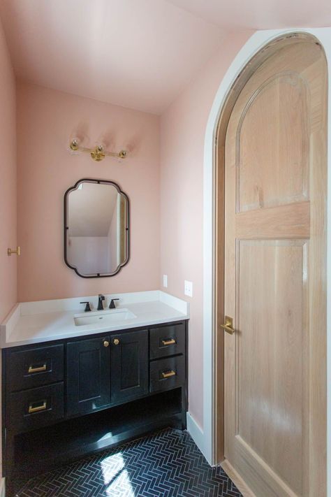 Blush pink powder bathroom with black vanity detail; herringbone black tile floors Black Floor Pink Walls, Blush And Navy Bathroom Ideas, Blush Pink And Black Bathroom, Black Pink And Gold Bathroom, Pink Black And Gold Bathroom, Old Pink Bathroom, Black White And Pink Bathroom, Pink And Navy Bathroom, Bathroom With Black Vanity