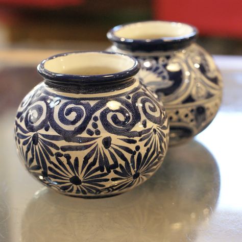 These small round handmade Mexican talavera flower vases from Dolores Hidalgo are one of our most popular gifts. We offer these very sweet flower vases in a small size. The patterns are varied but most have a mixture of lavender, cobalt blue, orange, yellow and red so the patterns mix and match with other talavera pieces extremely well. All patterns are unique so please allow us to choose for you from our remaining stock! We do not take photos of every individual design! Ceramics are not free to Pot Painted Ideas, Ceramics Vase Design, Ceramic Pot Design, Pottery Painting Designs Vase, Vase Ceramic Design, Mexican Pottery Designs, Pottery Designs Ideas, Ceramic Vase Ideas, Vase Patterns