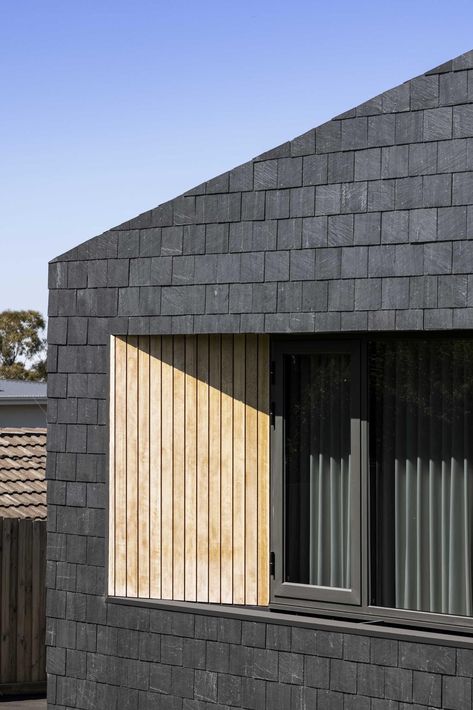 A modern house clad in black slate shingles, wood accents, and charcoal window frames. Zinc Extension, Kitchen Extension Open Plan, Slate Cladding, Flat Roof Design, Slate Shingles, Residential Landscape Design, Humble House, Engineered Timber Flooring, Sauna House