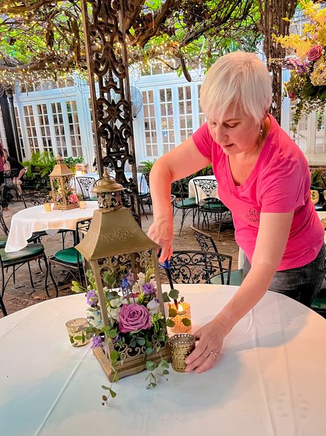 Watch as Diane, our leader, brings a touch of magic to the Court of Two Sisters! 🌸✨ Vintage lanterns become enchanting centerpieces with her bright, colorful arrangements. The glow of the candles alongside her creations sets the scene for an unforgettable reception under the New Orleans sunset. With every petal and candlelight, we craft not just beautiful settings, but lasting memories. 🕯️⁠ Tangled Centerpiece Ideas, Wedding Centerpieces Gold, Court Of Two Sisters, Rapunzel Theme, Art Gala, Tangled Lanterns, Gold Wedding Decor, Beautiful Settings, Effortless Wedding