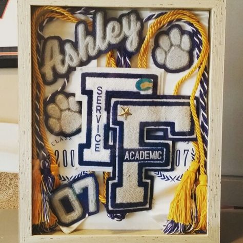 High school memorabilia shadow box. Letter jacket alternative Letter Shadow Box Ideas, Varsity Letter Ideas, Sports Shadow Boxes, Shadow Box Graduation, Cheer Box, Graduation Memories, Letter Jacket, Photo Frame Decoration, Graduation Party High