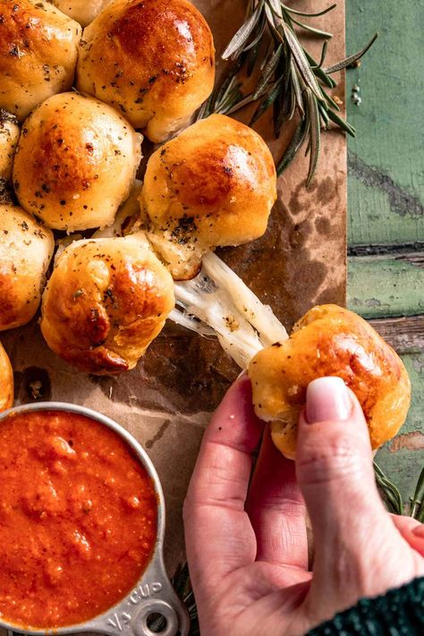 A festive, simple, and fun 20-minute appetizer! This Pull-Apart Cheesy Christmas Tree Bread features fresh-baked bread balls stuffed with melted cheese and topped with creamy garlic butter and parmesan cheese. Perfect for any gathering this holiday season! Cheesy Christmas Tree Bread, Bread Balls, Tree Bread, Christmas Tree Bread, Pull Apart Garlic Bread, Mozzarella Cheese Sticks, Diy Hot Cocoa, Garlic Cheese Bread, Garlic Cheese