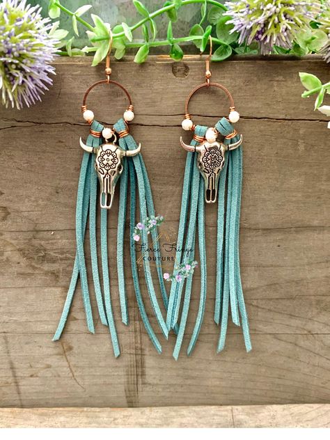 "Fringe Bullhead Charm Earrings: Item Details:  Handmade Faux Leather in Teal Approximately 5\" long from hook to end 3 Opal White Beads Rose Gold Accents Surgical Steel Hook in Rose Gold Bronze Hoop Silver Bullhorn Charm Lightweight" Beaded Leather Earrings, Trending Earrings 2024, Bandana Earrings, Leather Earrings Ideas, Rodeo Earrings, Diy Western Jewelry, Boho Earrings Diy, Feather Earrings Diy, Wood Bead Earrings