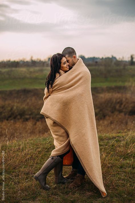 Young love couple hugging in nature, wrapped in a blanket Couple Wrapped In Blanket, Wrapped In Blanket, Spot Art, Autumn Shoot, Wrapped In A Blanket, Evermore Era, Autumn Love, Hugging Couple, Warm Hug