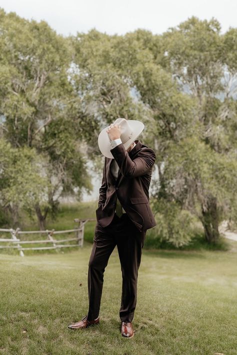 Still swooning over this elegant western chic destination wedding in Livingston, Montana. Located on the Yellowstone River, the brand new wedding venue was the perfect location -- coupled with the sweeping views of the rugged mountains. Montana wedding, destination wedding inspiration, groom attire, Western groom attire, brown suit, Western wedding dress, mountain wedding color scheme Grey Suit Wedding Color Schemes, Groom Attire Western, Mountain Wedding Groom Attire, Groom Attire Brown, Mountain Wedding Color Scheme, Cowboy Groom Attire, Western Groom Attire, Western Wedding Colors, Country Groom Attire