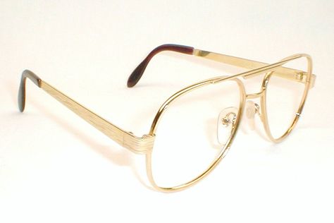 Mens Large Thick Gold Wire Aviator Eyeglasses #1970s worst period for fashion? http://www.eyeglassboy.com/RAY-BAN.HTML Glasses Aviator, Gold Eyeglasses Men, 70s Aviator Glasses, Wire Glasses Men, Best Mens Sunglasses, Gold Aviator Eyeglasses, Printable Islamic Art, Aviator Eyeglasses, نظارات شمسية