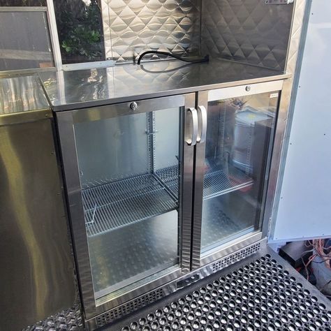 An under-counter fridge with glass doors will allow you to clearly see your refrigerator's contents while keeping them fresh and cold. LED lighting can illuminate them without the burnout or heat from conventional lightbulbs! To purchase or repair a food truck, visit our website at sdfoodtruckpros.com or give us a call at (858) 221-3095 . . . . . #sandiegofoodtruckpros #foodtruck #sdfoodtruck #foodtrucks #foodtrailer #sdfoodtrucks #sandiegofoodtrucks #sandiegofoodtruck #lafoodtrucks Food Truck Organization Ideas, Food Truck Refrigerator, Shipping Container Food Trailer, Horse Trailer Food Truck Conversion, Converted Horse Box Food Truck, Food Truck Equipment, Enclosed Trailer Food Truck, Pizza Trailer, Truck Kitchen