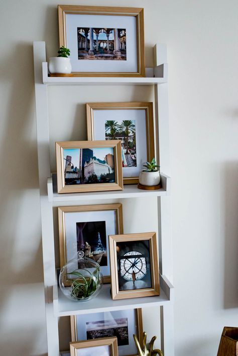 How To Style A Ladder Bookshelf Displaying Photos On Bookshelves, Ladder Shelf Picture Display, Bookshelf Photo Display, Style A Ladder Shelf, Bookshelf Picture Frames Display, Styling Ladder Bookshelves, Decorating A Ladder Shelf, Ladder Bookshelf Styling, Ladder Bookshelf Decor