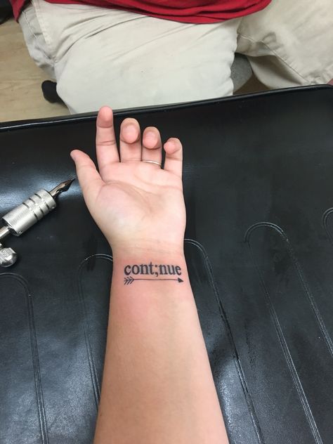 Just got my first tattoo, in love!! "Continue" to never give up and to keep moving forward ";" to represent that my story isn't over yet And the arrow means that life may hold you back with bad things but once you let them go you'll be free You’ll Get Over It Tattoo, Continue Tattoo Ideas, Cont;nue Tattoo, Keep Holding On Tattoo, To Be Continued Tattoo, Forward Tattoo, Small First Tattoo Ideas Meaningful, Be Free Tattoo, Keep Going Tattoos Symbol