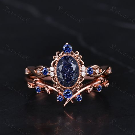 5x7mm Filigree Oval Blue Sandstone Bridal Ring Set Vintage Sapphire Leaf Engagement Ring Art Deco Women Promise Anniversary Ring Unique Gift Side stones: blue sapphire and moissanite This ring can also be made in genuine solid 10k, 14k, 18k gold or Platinum, and all the rings in my shop can be customized too! If you want to know more details about the ring, just contact with me anytime! If you want to customize the ring, just contact with me anytime! If you want to make a custom jewelry, just contact with me anytime! PROCESS TIME AND SHIPPING It usually takes about 3-4 weeks to finish the ring and 4-6 days to deliver to you if you are in US. (Free Shipping within US!) We will offer you the tracking number once your ring is shipped. WARRANTY 30 days money back guarantee! If you have any que Moissanite Sapphire Ring, Blue Goldstone Ring, Vintage Sapphire Engagement Rings, Wedding Ring Sapphire, Fairytale Engagement Rings, Blue Sandstone Ring, Blue Sandstone Engagement Ring, Sapphire Bridal Set, Art Deco Women