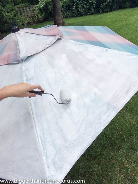 Painting an outdoor umbrella with a roller--ended up using paint sprayer Patio Umbrellas Diy, Patio Umbrella Lights, Outdoor Umbrella Stand, Umbrella Painting, Patio Umbrella Stand, Umbrella Lights, Garden Umbrella, Outdoor Diy Projects, Canopy Outdoor