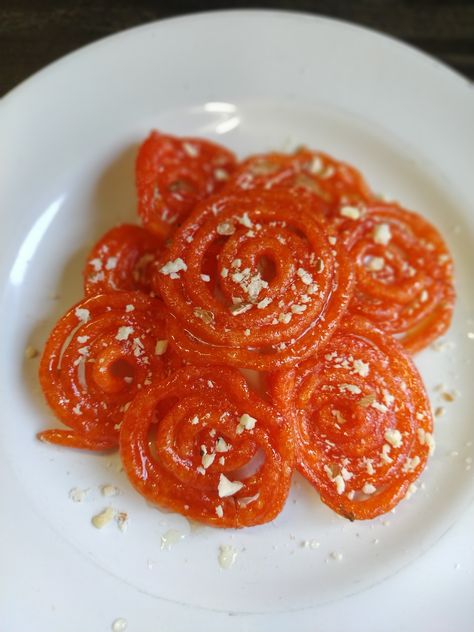 Imarti is a popular Rajasthani sweet which has only 4 ingredients which makes delicious crispy imartis. It is very similar to jalebis. You can serve it hot or cold as per your preference. This is one of the most devoured dishes during the festive season. Saffron Color, Rajasthani Food, Urad Dal, It's Hot, 4 Ingredients, Festive Season, Festival Season, Cooking Recipes, At Home