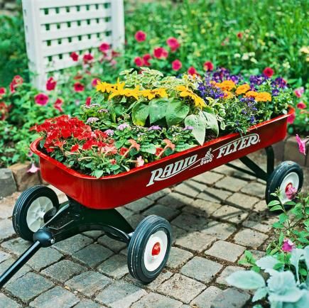 25 Creative Garden Containers | Midwest Living Planting A Rainbow, Wagon Planter, Garden Wagon, Portable Garden, Early Spring Flowers, Rectangular Planters, Garden Containers, Plant Combinations, Container Flowers