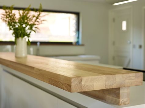 bulthaup wooden bartop. -This solid wood breakfast bar is made of ash and is slightly raised to offer screening to the open plan kitchen island. South Devon Kitchen Project | Sapphire Spaces Wood Breakfast Bar, Lounge Seating Area, Wooden Pantry, Kitchen Peninsula, Kitchen Island Plans, Kitchen Island Bar, Wood Kitchen Island, Breakfast Bar Kitchen, Kitchen Design Open