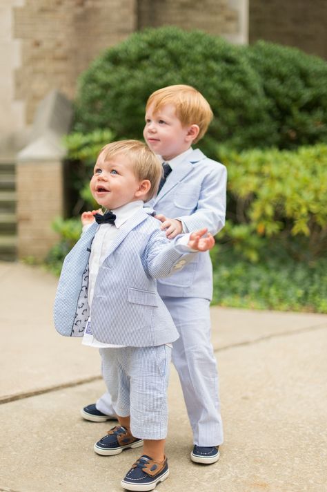 The ring bearer was the couple’s nephew. He wore a seersucker suit, blue tie and navy boat shoes. “It was the cutest thing ever!” says Amber. Suit And Bow Tie, White Tuxedo Wedding, Boys Formal Wear, Boys Tuxedo, Seersucker Suit, Bearer Outfit, Ring Bearer Outfit, Prom Suits, Girls Shoes Kids