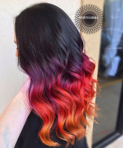 Beautiful sunset ombre hair color on long wavy hair. Looking for some fabulous hair inspo? This collection of the 21 most gorgeous hair color ideas will help you find the perfect shade. From stunning ombres to trendy vibrant shades, we've got you covered. Say goodbye to boring hair and make a bold statement with a fresh new hair color. Balayage Vivid Color, Sunset Hair Color Ombre, Sunset Ombre Hair, Fire Ombre Hair, Sunset Hair Color, Flame Hair, Sunset Ombre, Sunset Hair, Fabulous Hair