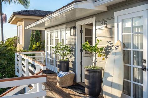 A cottage style second floor deck features potted lemon trees, a black doormat and a woven basket. Coastal Images, Wood Deck Railing, Second Floor Deck, White Beach House, Beachside Bungalow, Deck Railing Design, Modern Deck, Lemon Trees, Beach Bungalow