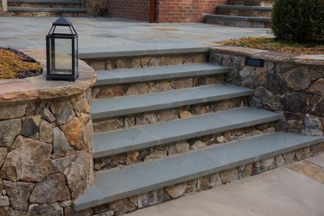 Pennsylvania bluestone treads are placed over Tennessee dry stack fieldstone for these patio steps. The wall and wall caps also are made of Tennessee fieldstone selected by Atlanta-based King Landscaping. Outdoor Stone Steps, Backyard Door, Bluestone Steps, Patio Stairs, Front Porch Steps, Front Door Steps, Front Stairs, Patio Steps, Entry Stairs