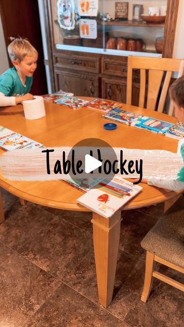 Brittany | Kids/Toddler/Baby Activities on Instagram: "We are absolutely loving this DIY air hockey game (idea found from @doktorbianneden ). My 6 year old constantly asks to play and it’s actually fun, not only for kids but for adults to play too.   For this family fun activity, build borders on your table using books. Then grab toilet paper rolls and a container lid and you are ready to play! Hit the lid off the end of your opponent’s side of the table to score a point.   #kidsactivities #kidsactivity #kidsactivityideas #toddleractivities #familyfun #familygames #familygame #familygamenight #diygame #kidsgame #kidsgames #toddlergames" Diy Air Hockey Game, Table Hockey Game Diy, Air Hockey Diy, Diy Air Hockey Table, Table Games For Kids, Hockey Diy, Jar Games, Table Hockey, Air Hockey Table