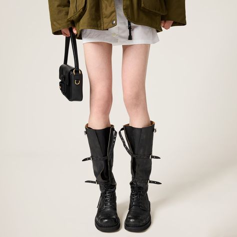 Black Leather Boots | Miu Miu Miu Miu Boots, Miu Miu Logo, Black Cocoa, Boot Straps, Cocoa Brown, Buckle Boots, Rubber Heels, Black Leather Boots, Metallic Logo