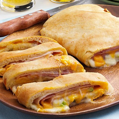 Ham and Cheese Loaf Recipe -This golden loaf relies on the convenience of refrigerated dough that's stuffed with ham and cheese. I created the recipe by experimenting with a few simple ingredients my family loves. It makes a delicious hot sandwich in no time. —Glorida Lindell, Welcome, Minnesota Ham And Cheese Loaf, Pizza Loaf Recipe, Cheese Stromboli, Cheese Loaf, Pepperoni Bread, Cheese Crust Pizza, Stromboli Recipe, Frozen Bread Dough, Italian Meats