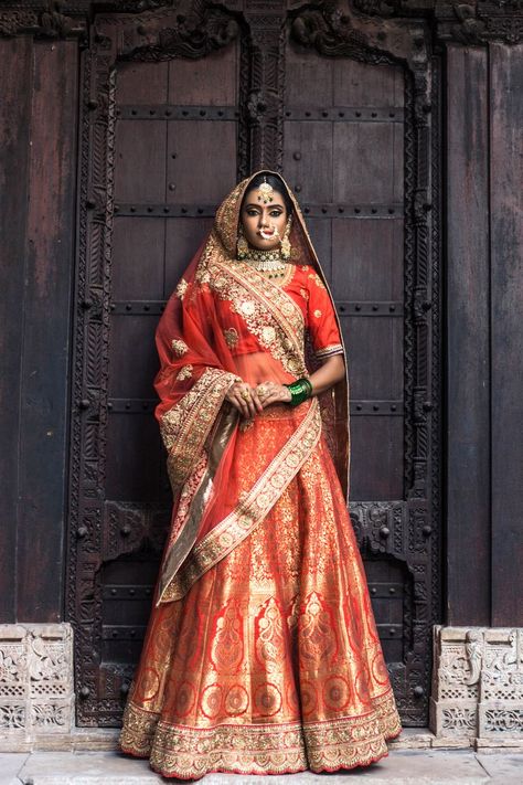 Pretty red and orange benarasi lehenga for wedding. See more on wedmegood.com  #wedmegood #indianwedding #indianbride #lehenga #lehengacholi #bridallehenga #jewelry #jewellery #orange #red Bride Lengha, Banarasi Lehengas, भारतीय दुल्हन संबंधी, Lehenga Images, Brocade Blouse Designs, Orange Lehenga, Rajasthani Dress, Indian Bridal Lehenga, Telugu Brides