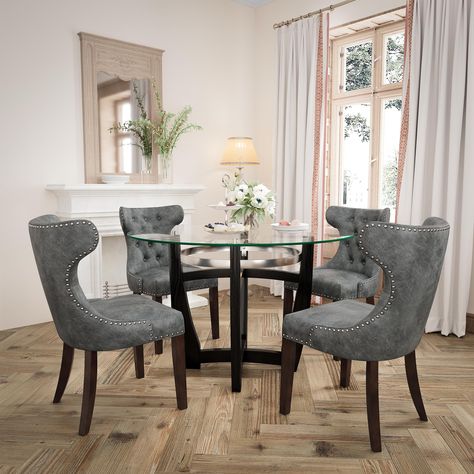 PRICES MAY VARY. Chic Glass Dining Table Chair Set: Full of modern charm, PADMA HOUSE Dining Table made of solid wood leg base and tempered glasstop, making a stylish statement. The wingback dining chairs built with wood legs and PU leather finish plus nailhead trim are sure to add a touch of elegance to your home. Easy to Storage and Keep Tidy: The chairs can be moved under the dining table when you finish your meal, and our kitchen table set largely helps you save room space. Featuring smooth Glam Dining Room, Wingback Dining Chair, Kitchen Table Set, 60th Bday, Round Kitchen Table, Dining Table Chair, Leather Dining Room Chairs, Round Kitchen, Luxury Dining Room