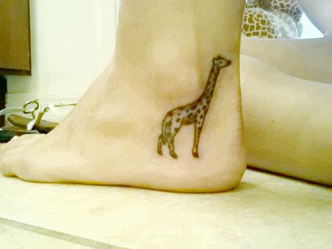 Ankle tattoo giraffe tattoo Giraffe Tattoo, Sock Tattoo, Remembrance Tattoos, Comic Tattoo, Crazy Ideas, Arrow Tattoos, Dream Tattoos, Tat Ideas, Great Tattoos