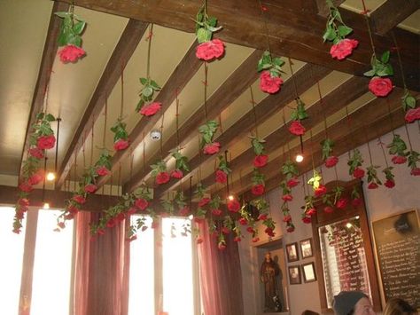 Roses hanging from the ceiling How To Hang Roses From Ceiling, Upside Down Roses Decor, Red Roses Hanging From Ceiling, Roses Hanging From Balloons, Rose Hanging From Ceiling, Rose Ceiling Decor, Falling Roses Ceiling, Roses From Ceiling, Hanging Roses From Ceiling