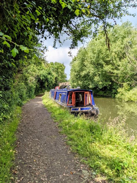 Blue narrowboat moored on a quiet towpath surrounded by trees Canal Aesthetic, Houseboat Living, Uk Weather, Holiday Storage, Boat Life, Packing Guide, Holiday Packing, Boat House, Canal Boat