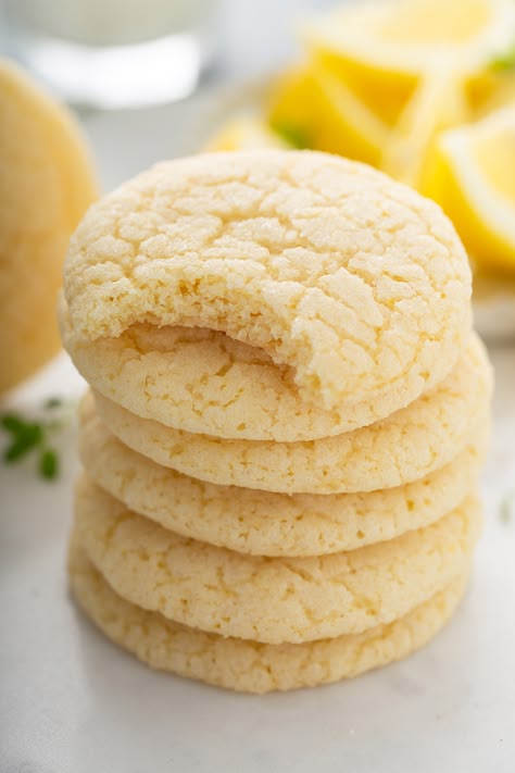 Stack of chewy lemon sugar cookies. The top cookie has a bite taken out of it. Lemon Sugar Cookies Recipe, Future Grandma, Lemon Cake Mix Cookies, Lemon Cookies Easy, Lemon Cake Easy, Lemon Cookies Recipes, Sugar Cookie Mix, Brownies Cookies, Lemon Sugar Cookies