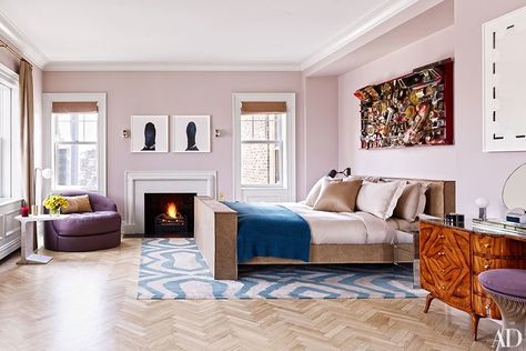 An artwork by Rammellzee hangs over the master suite's bed, which is dressed with a cashmere blanket by the Elder Statesman, in a Manhattan penthouse designed by Rafael de Cárdenas | archdigest.com Jewel Tone Living Room Decor, Jewel Tone Living Room, Celebrity Bedrooms, Manhattan Penthouse, Penthouse Design, Paint Color Inspiration, Bedroom Fireplace, Bedroom Color Schemes, New York Apartment