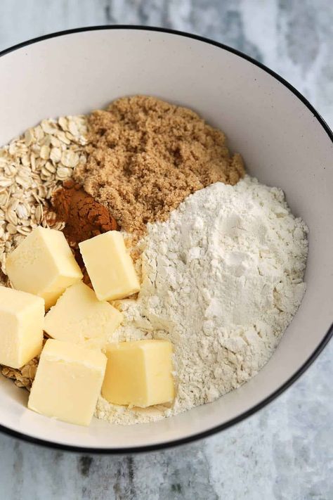 bowl of oat crumble ingredients with cold butter, flour, brown sugar, oats, and cinnamon Crumb Topping For Apple Pie Crumble, Oat Crumble Skillet, Apple Pie Crumble Topping Recipe With Oats, Apple Crumble Pie With Oats, No Bake Apple Crumble, Apple Crisp Streusel Topping, Pecan Oat Crumble Topping, Apple Crumble Topping Oats, Basic Crumble Topping