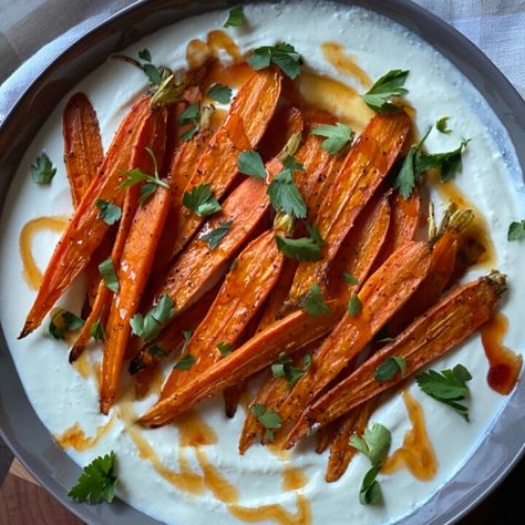 A drizzle of hot honey takes these roasted carrots over the top. Paired with a creamy, whipped feta, this side dish is beautifully paired with your favorite protein (think roasted chicken or grilled salmon filets). The flavor, with a hint of heat, is so well balanced and makes the idea of eating you... Whipped Feta And Carrots, Whipped Feta Carrots, Roasted Carrots With Whipped Ricotta And Hot Honey, Roasted Carrots With Whipped Feta, Carrots With Whipped Feta, Baked Carrots Recipe, Carrots Side Dish, Honey Carrots, Salmon Filets