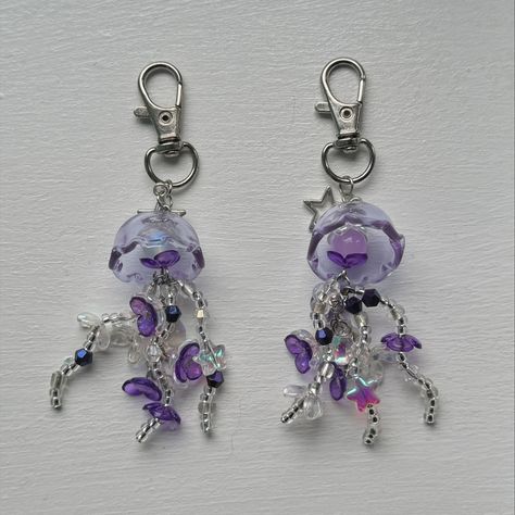 Jelly Belly Jellyfish 🪼 (depop rubysgemss) ✰ £5.00 ✰ Keychain ✰ handmade ✰ when buying please lmk which one you want or i will refund tags 🏷️ #keychain #jellyfish #smallbusiness #handmadejewellery #beadedjewellery #rubysgemss #rubyssgemss Gelang Beads, Beaded Jellyfish, Jellyfish Keychain, Purple Jellyfish, Beaded Ideas, Manik Manik, Keychain Handmade, Jelly Fish, Jelly Belly