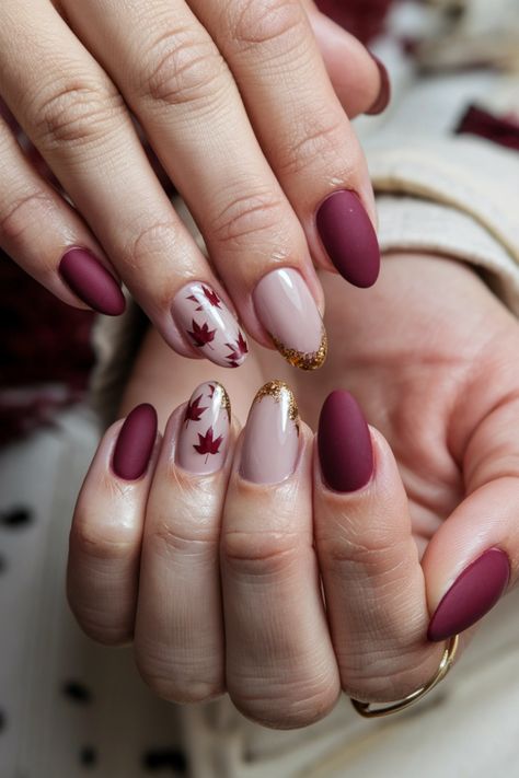 Embrace the beauty of the season with these chic Autumn short nails. Featuring a cozy mix of deep burgundy and shimmering gold accents, this stunning style captures the essence of fall perfectly. The rich colors evoke the changing leaves, making it a perfect choice for any autumn occasion. Transform your look with these delightful fall nail ideas and let your nails shine with seasonal elegance! #FallNailIdeas #AutumnNails #ChicNails #NailArt Short Nails Design Ideas 2024 Autumn, Maroon Autumn Nails, Elegant Fall Nail Art, Autumn Burgundy Nails, Thanksgiving Nails Burgundy, Fall Leaves Nails Design, Fall Nail Designs Leaves, Nail Design Ideas Fall, Autumn Design Nails