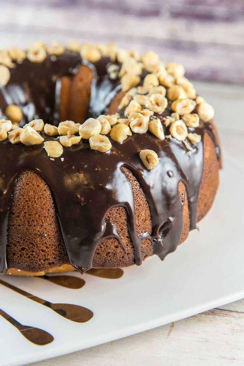 Nutella Bundt Cake: an easy buttery vanilla cake with swirls of nutella and a decadent chocolate nutella glaze. Perfect for birthdays and celebrations! #bunsenburnerbakery #bundtcake #nutellacake #nutella Nutella Bundt Cake, Bunt Cake Recipe, Cake Recipes At Home, Cake Recipes For Kids, Nutella Desserts, Bundt Cake Recipe, Nutella Cake, Banana Nutella, Banana Cake Recipe