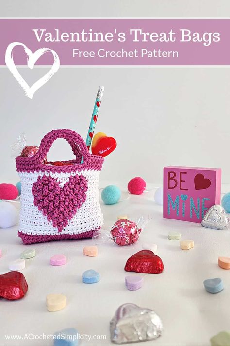 Learn to crochet Valentine Treat Bags with this quick and easy free crochet pattern. Fill with candy and pencils for a quick little gift! #valentinescrochetpatterns #freecrochetpattern #crochettreatbag #crochetcandybag #crochetgiftbag #valentinescrochetproject #crochetideasforvalentines #easyvalentinescrochetpattern #classroomvalentinestreats #crochet #valentinesday #valentinesforkids #crochetforkids #crochetgoodybag #crochetheartbag #crochetheart #crochetbag Valentine Treat Bags, Crochet Valentine Patterns, Crochet Valentine, Valentine Treat, Valentine Baskets, Crochet Baskets, Valentines Patterns, Valentines Crochet, Crochet Market Bag