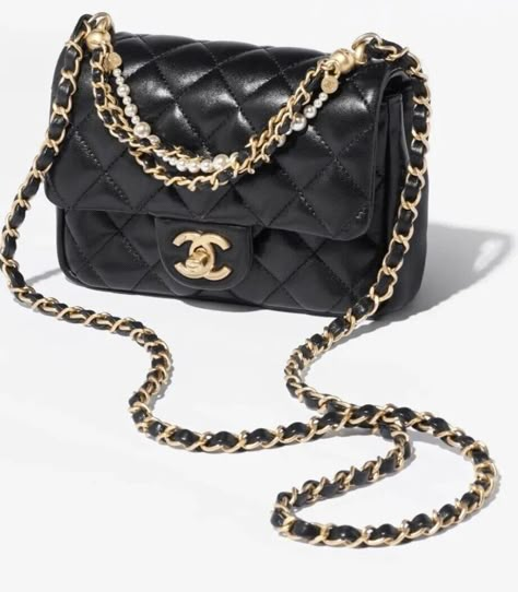 This is the beautiful Chanel Mini Flap bag in Black Lambskin from the 2024 24P collection featuring gold hardware and Pearl details.🔥 This bag is brand new, untouched. I will provide photos of the bag itself but I keep the bag well packed as originally packaged Includes all original packing materials: box, flower, ribbon, receipt upon request. Bag will be shipped to authenticator using insured shipping. 100% Authenticity guaranteed!! Comes with all an original packaging as from a Chanel boutique! 5.7 x 7.6 x 2.9 in ( cm ) It’s a timeless statement piece!! Newest 2024 spring pre collection 💥💥💥 Rarely seen! Chanel Mini Flap Bag, Chic Purses, Shopping Wishlist, Dream Bags, Chanel Boutique, Pearl Details, Chanel Mini, Chanel Purse, Cute Purses