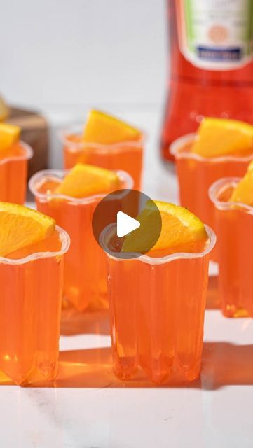 Sarah Gualtieri on Instagram: "Bring these to your next summer party 🥂

Aperol Spritz Jell-o Shots

Makes 12-14

1.5 cups Prosecco
1/2 cup Aperol
1 package of orange Jell-o
1/3 cup sugar

Add 1 cup of Prosecco, 1 orange jell-o and 1/3 cup of sugar to a sauce pan and cook on low for 3 minutes, stirring to dissolve the sugar and jell-o.

Add 1/2 cup chilled Prosecco and 1/2 cup Aperol. Stir well to combine.

Add to mini cups and refrigerate for at least two hours to set

#jelloshots #aperol #prosecco" Aperol Jello Shots, Aperol Spritz Jello Shots, Jello Shooters, Jell O Shots, Mini Cups, Entertaining Food, Facebook Recipes, Cocktail Drinks Alcoholic, Boozy Drinks