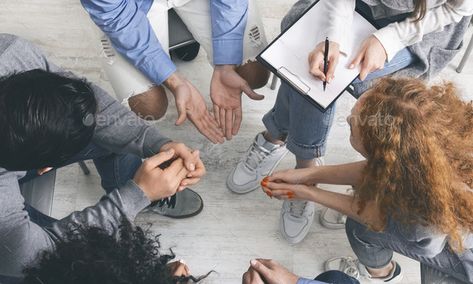 Diverse people sharing their problems at group therapy session, top view by Prostock-studio. Trust circle. Diverse people sharing their problems with psychologist at group therapy session, counselor taking note... #AD #therapy, #group, #top, #session Social Work Jobs, Mental Health Clinic, Clinical Social Work, Diverse People, Rehab Center, How To Motivate Employees, Therapeutic Activities, Clinical Psychologist, Case Management