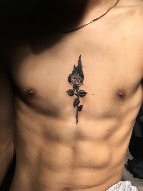 It’s a rose in flames Burning Rose Tattoo Men, Man On Fire Tattoo, Rose With Fire Tattoo, Rose Chest Tattoo Men, Rose Tattoo Men Chest, Flame Rose Tattoo, Flaming Rose Tattoo, Male Rose Tattoo, Burning Rose Tattoo