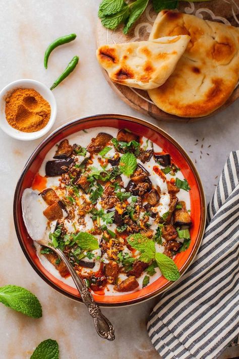 Eggplant in tempered yogurt served with chaat masala and naan. Creamy Eggplant, Pan Fried Eggplant, Baingan Recipe, Eggplant Varieties, Crispy Flatbread, Cashew Yogurt, Indian Vegetarian Dishes, Garam Masala Spice, Entertaining Menu