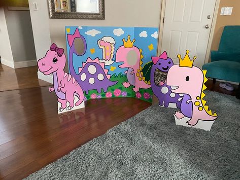 Pink Dinosaur Party Table, Dinosaur Face In Hole, Pink Dinosaur Decorations, Pink Dinosaur Birthday Party Decorations, Dinosaurs And Unicorns Party Decorations, Pink Dinosaur Party Food, Triceratops Birthday Party, Dinosaur Themed Birthday Party Girl, Dino Birthday Party Games