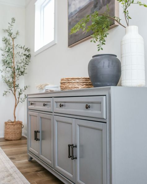 We have been slowly redoing our dining room and we have been looking for a statement piece for this wall. I still have yet to find something I love, so in the meantime we have this sideboard! Comment SIDEBOARD if you want the link! ‌ ‌ #homedecor #diningroom #interiordesign #statementpiece #sideboard #homeinspiration #roommakeover #decorgoals #homestyle #designinspo Dining Room Gray, Grey Dining Room, In The Meantime, Room Makeover, Design Inspo, Sideboard, Statement Pieces, Dining Room, I Love