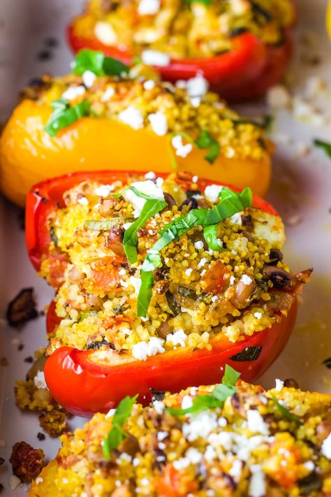 Vegetarian Mediterranean stuffed peppers with couscous are easy to make, healthy, and packed with fresh Greek flavors. Perfect as a main or side, they are as nutritious as they are delicious. Winter Mediterranean Recipes, Vegetarian Entrees Main Dishes, Stuffed Peppers With Couscous, Stuffed Paprika, Vegan Mediterranean Recipes, Mediterranean Stuffed Peppers, Couscous Stuffed Peppers, Couscous Dinner, Veggie Entrees